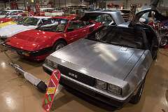 Upper Coomera, Queensland, Australia - A DMC DeLorean, designed by Giorgetto Giugiaro, with gull-wing doors and brushed stainless-steel body, and a Ferrari Mondial 8, a mid-engined, V8, grand tourer designed by Pininfarina; both of 1981-'82.