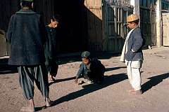 Playing marbles in the town of Ghazni.