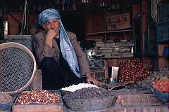 A friendly shopkeeper waiting for customers in this open-fronted shop, typical of Afghanistan. Herat is an agricultural as well as a cultural centre.