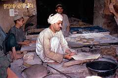 “Nan”, the traditional Afghani bread, is made by shaping dough into large circular slabs that are then slapped against the walls inside the stone ovens to cook. Delicious.