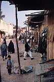 A typical scene in the business area of Herat; the shops have awnings over the entrances.