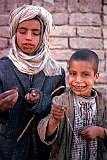 Free toys: these boys had tied large wasps to strings and let them fly around like miniature kites.