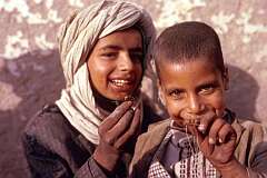 Free toys: these boys had tied large wasps to strings and let them fly around like miniature kites.