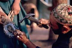 Fitting out a horse with new horseshoes is a job that has to be done frequently in a country that makes good use of the original horsepower.