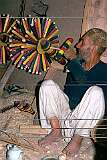 Making spindles in a workshop in Herat. Bright colours turn it into a work of art.