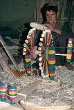 Making spindles in a workshop in Herat. Bright colours turn it into a work of art.