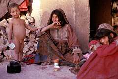 A grandmother of one of the nomadic tribes of Afghanistan is looking after her grandchildren on the outskirts of Herat.