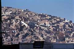 Whole neighbourhoods have been built on the barren hills surrounding the downtown area of Kabul.