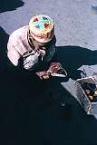 A young Kabuli shoeshine boy. Life is tough for many children who have to earn their keep from an early age.