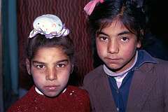 Two Sikh boys from Kabul. The Sikhs are a minority group in Afghanistan and distinguish themselves by never cutting their hair. The boys' topknot will later be covered by a turban.