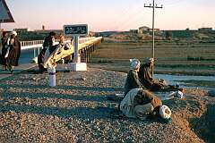 On the road in Afghanistan: Afternoon prayers along the road near Khash Rud, not far from Kandahar. The bus stopped here to give people opportunity to fulfil their religious obligations