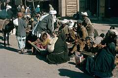 A street market in the bazaar of Kandahar. Kebabs are prepared.