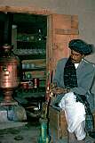 A man prepares his water pipe in one of the many “chai kana” or tea houses in Kandahar, a favourite meeting place for the men of Afghanistan.