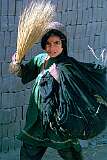 A girl with a broom in the village of Deh Khatay, just outside Kandahar.