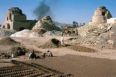 Bricks are cut by hand near the kilns where they will be baked, in the village of Deh Khatay, just outside Kandahar.