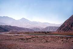 Mountain scenery  and river on the road to the Hindu Kush, in the north east of the country.