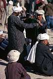 Shopping for clothes on Mazar's bustling market.