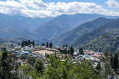 View of Bomdila and its sports ground from the road to the Upper Gompa of the Monastery.