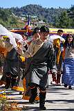 Students perform a Tibetan group dance, with “khata” ceremonial shawls.