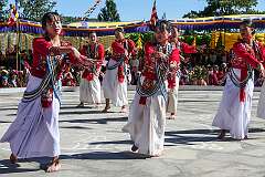 Young women perform a group dance.