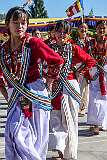 Young women perform a group dance.