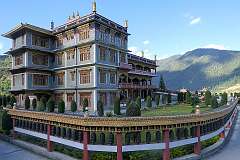 The Thupsung Dhargye Ling Buddhist Monastery, with its wall of prayer wheels.