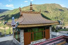 A small building with a gilded roof at the TDL Buddhist Monastery.