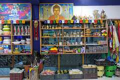 Buddhist objects for sale, in the Eight Lucky Sign Homestay in Dirang.