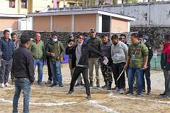 Men playing “Punggor” (shotput), one of the games in the Tawang Festival showground.