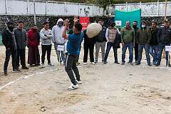 “Behgor”, lifting a large boulder and throwing it over his shoulder, by a performer at the festival.