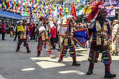 Masked temple dancers, in the Carnival Parade on the first day of the Tawang Festival.