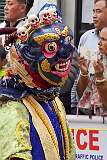 A masked temple dancer, in the Carnival Parade on the last day of the Tawang Festival.