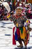 A masked dancer during the temple ceremony.