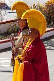 Monks with ceremonial headdresses and Gya-Ling instruments.