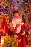 A ritual by a monk during the Torgya ceremony on the terrace in front of the main entrance of the monastery.