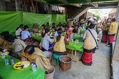 Women having lunch, provided for the guests at the Eli ceremony in Tajang Village.