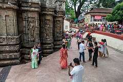 Visitors having their picture taken in front of the adhisthana (base) of the Maa Kamakhya Temple.
