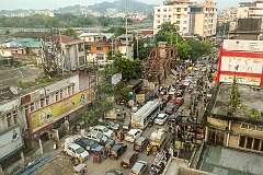 View along Assam Trunk Road with traffic from Hotel City Palace, Paltan Bazar.