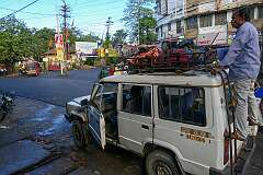 A Mahindra Sumo being packed with luggage, along Lumding-Silchar Road at the junction with Itkhola Road in Silchar, 300 kilometres southeast of Guwahati.