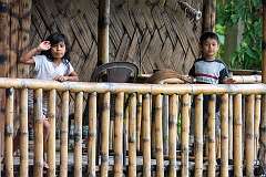 Children on the veranda of a house at Kaibortta Gaon, North Lakhimpur.