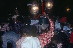Men with lamps and a Sikh drummer at a Baraat wedding procession in Paharganj, in Central Delhi.