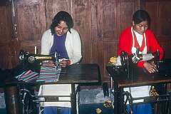 Young women at their sewing machines, in a workshop at the Tibetan Children's Village.