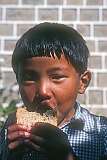 A small Tibetan boy, a child of refugees that fled Tibet after the Chinese annexation of their homeland.