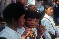 Boys of the Tibetan Children's Village playing flutes during the festivities.
