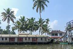 A houseboat and a foot bridge at SNDP Thodu, in Mullakal, the backwaters of Alappuzha.