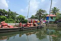 A boat with gas bottles on the Umbikkaram Thodu canal.