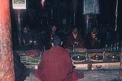 Cymbals being played at the daily ritual, with Buddhist chanting , accompanied by various musical instruments.