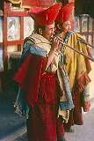 Two monks playing the “Duncheng” horns at a ceremony.