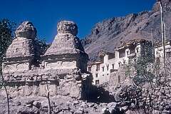 Two chorten or stupas, and a house in Khalsi.