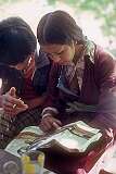 A young Ladakhi couple in Khalsi, reading a magazine.